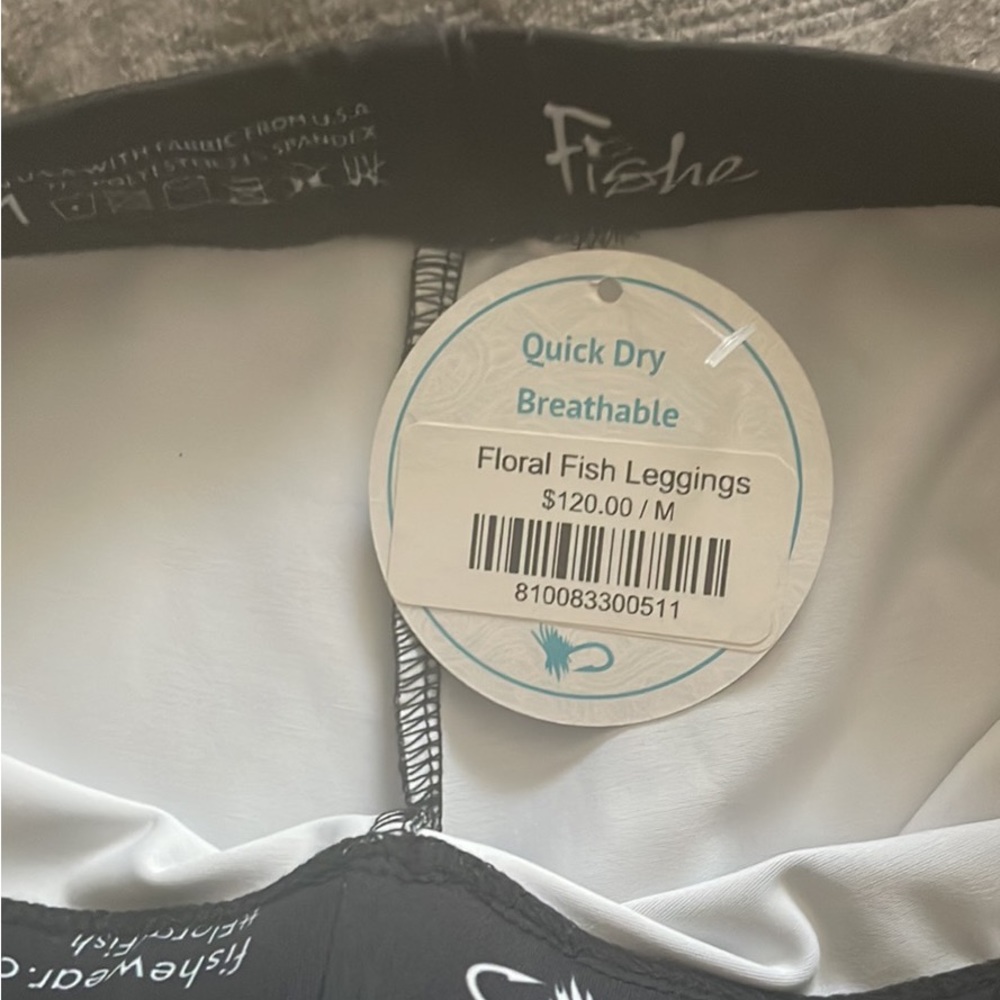 Fishy leggings size M. Never warn was gifted but too big.